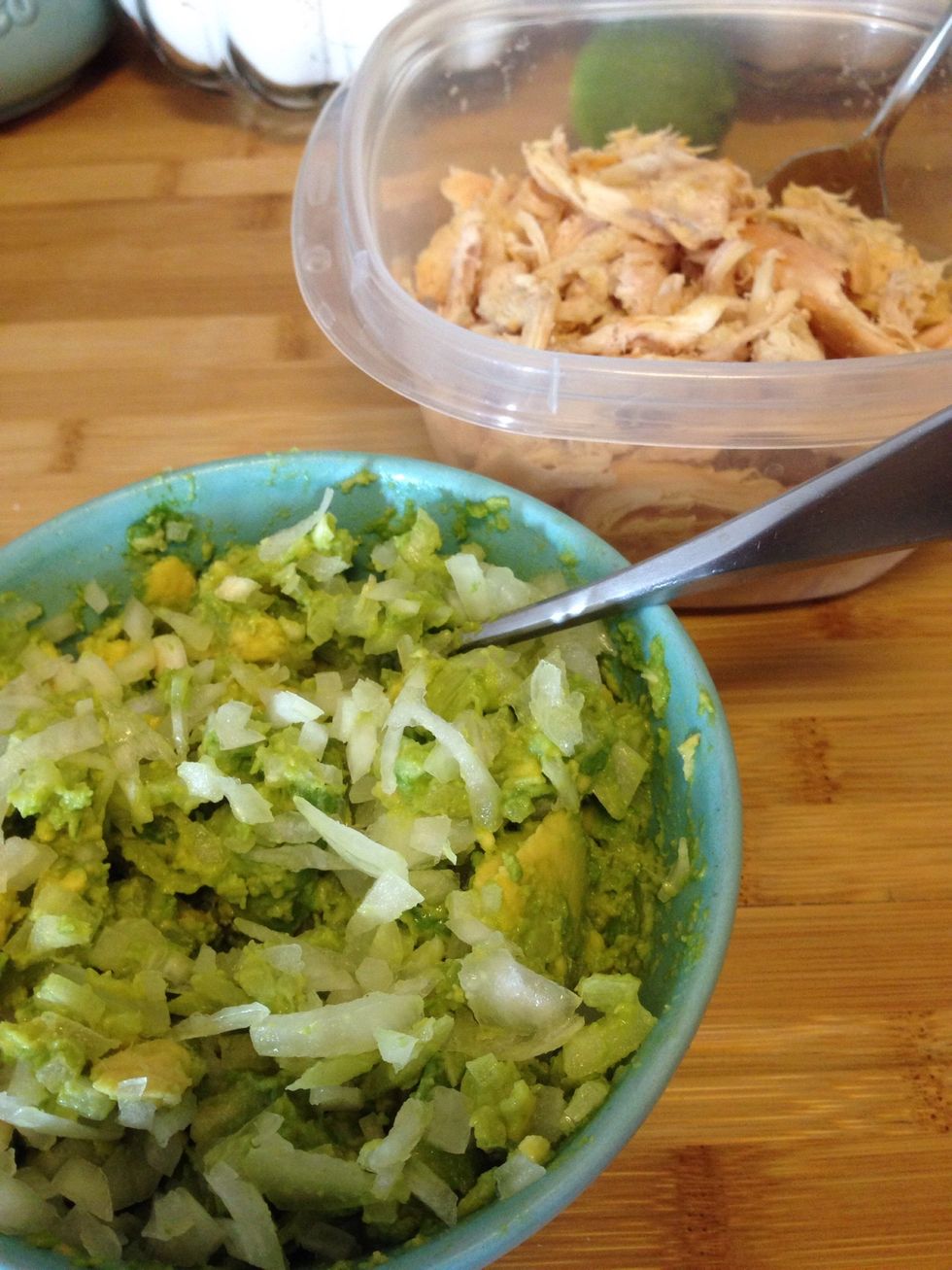 In a bowl, mash the avocados and stir in the diced onions. Once combined, squeeze in the lime juice and stir.