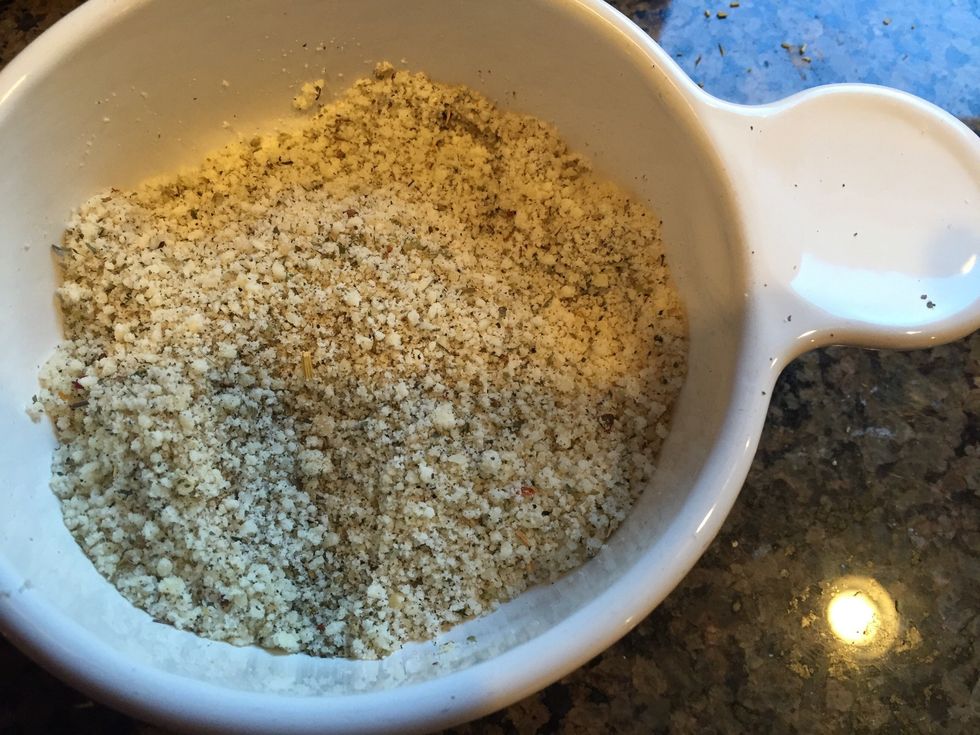 In a bowl, mix Parmesan cheese, oregano, Italian seasoning, salt & pepper.