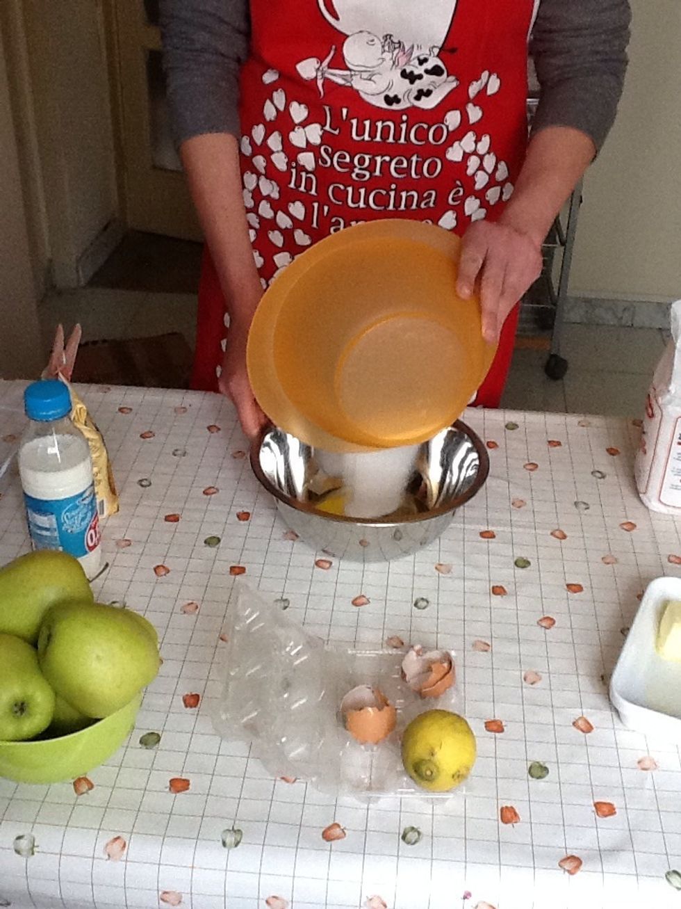 In a bowl mix the eggs with sugar until fluffy.....you can use a hand mixer or a wooden spoon