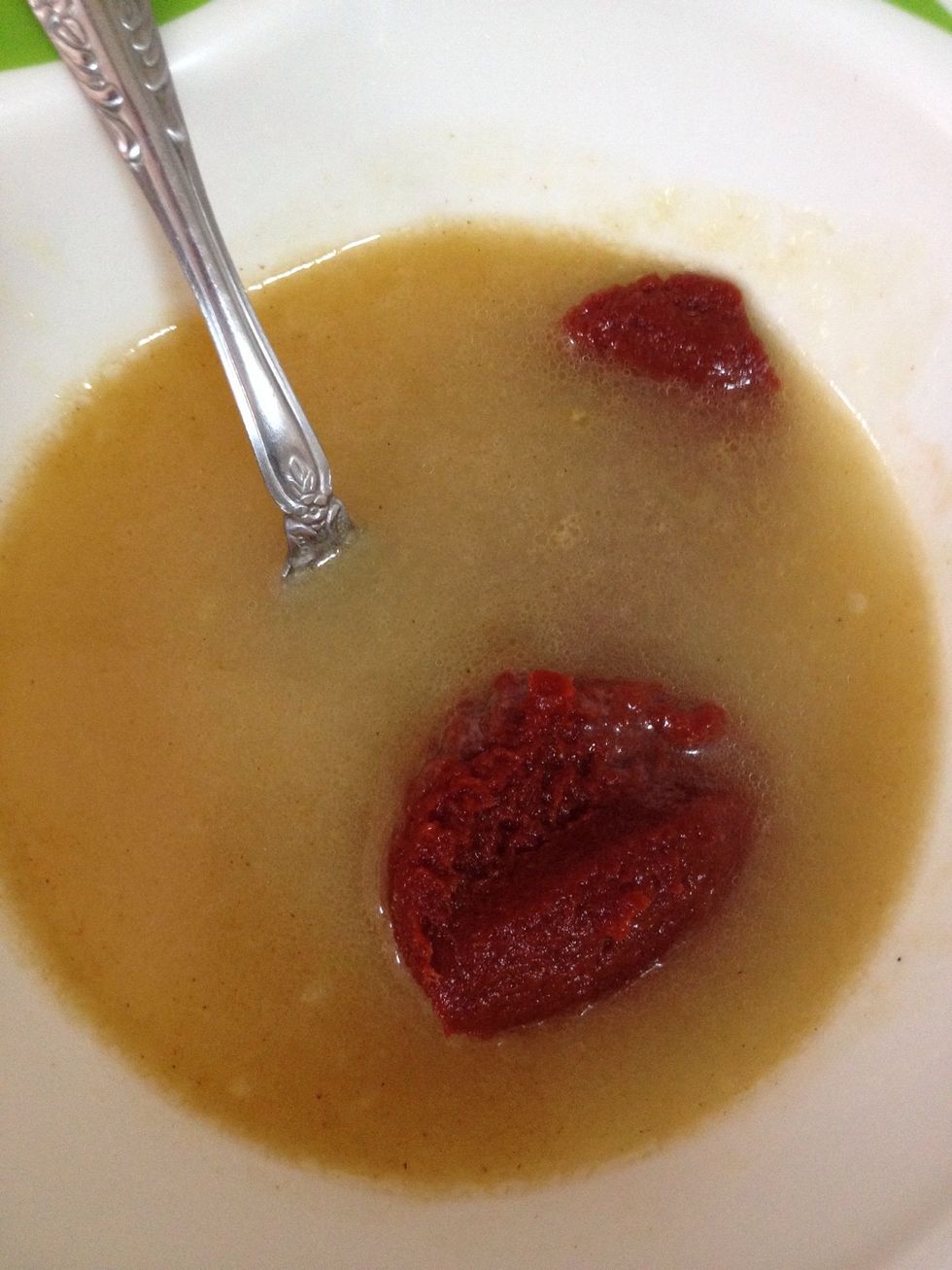 In a bowl, mix the tomato paste and the beef cube. (I used the hot water from the pasta. You can use beef broth instead of beef cube).