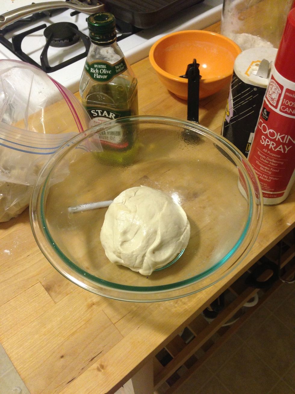 In a bowl, spray nonstick spray. Put the dough in a bowl and cover with a damp towel and let the dough rise for 2-3 hrs. Keep in a warm but not hot location.