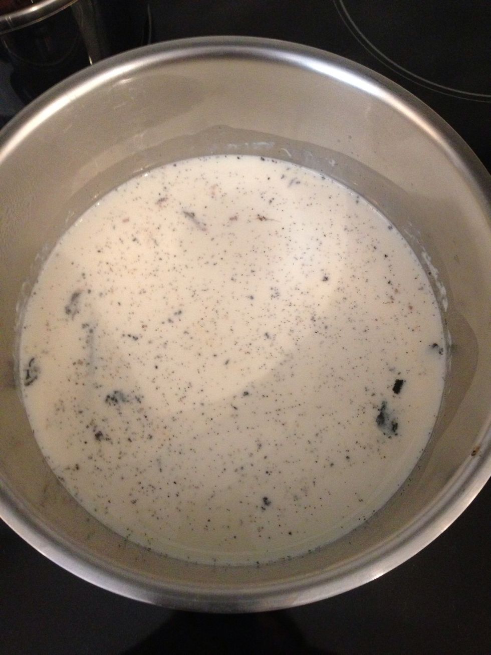 In a casserole put the milk. Leaving around 2TBsp aside for emergency... Slit z vanilla bean scrape the inside. Add to z milk. U can put the vanilla bean shell as well for more intense flavour