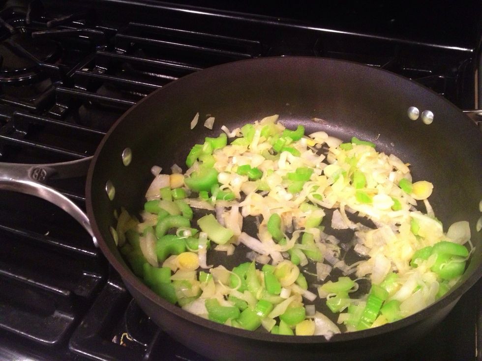 In a deep pan or soup pot add the diced veggies with a little bit of olive oil... Saut\u00e9e over medium heat for about 1-2 minutes