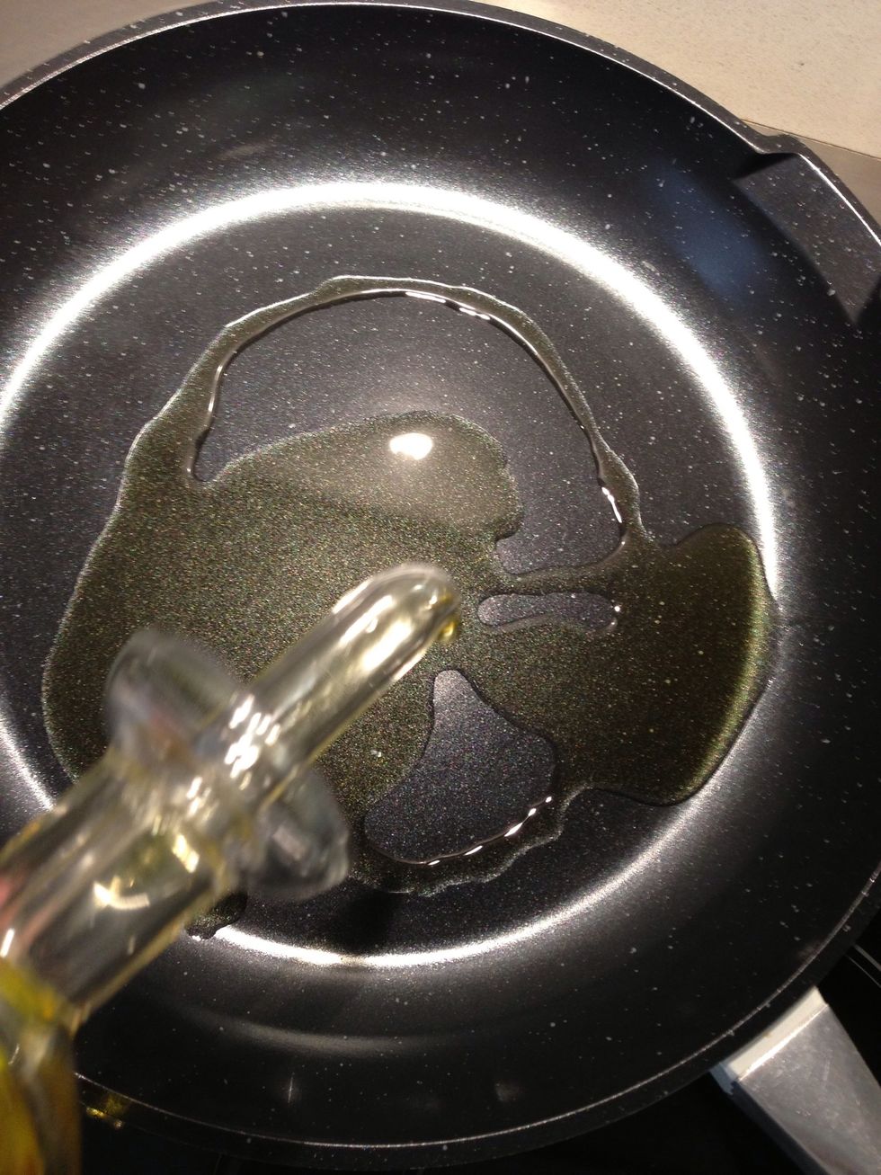 In a deep skillet, put 3-4 TBsp olive oil. Add diced onion and crushed garlic. Sweat