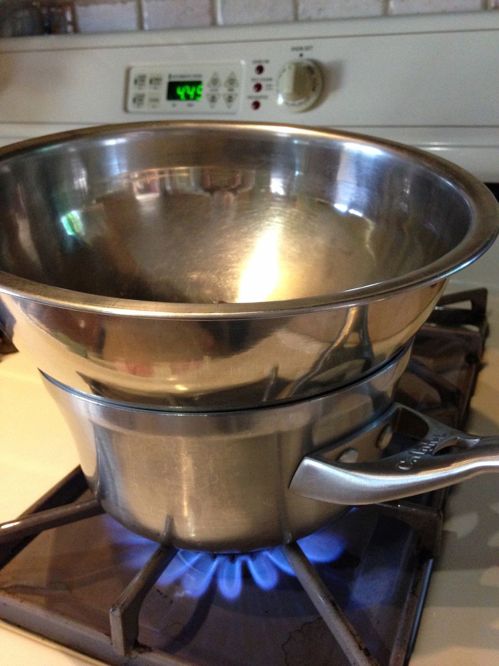 In a double boiler, add your chocolate in the bowl. Put water in the pot and bring to a boil.