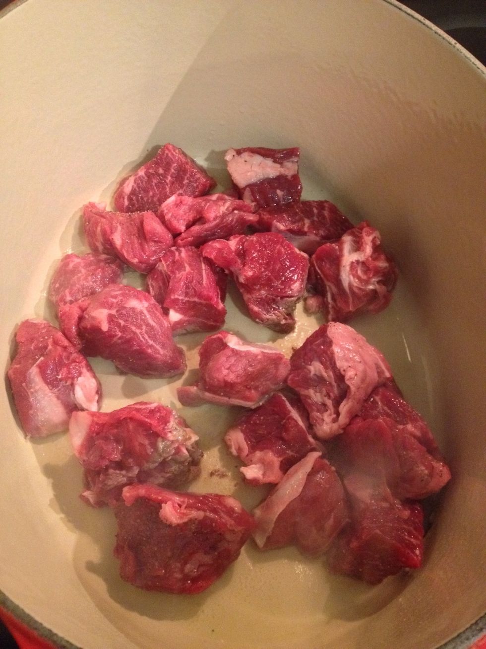 In a Dutch oven, brown your beef with olive oil.