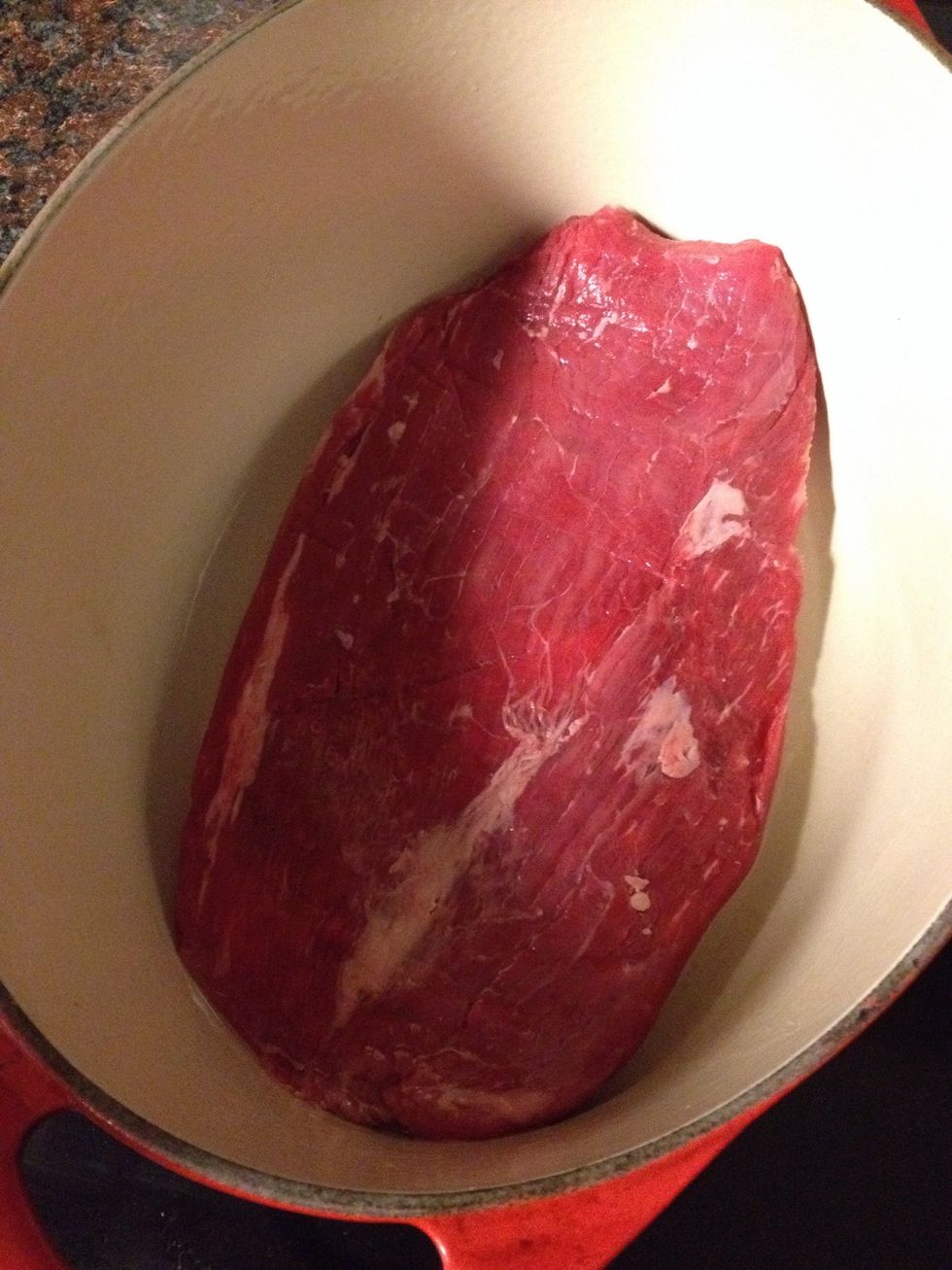 In a Dutch oven, brown your flank steak.  Add 1 teaspoon of salt on both sides