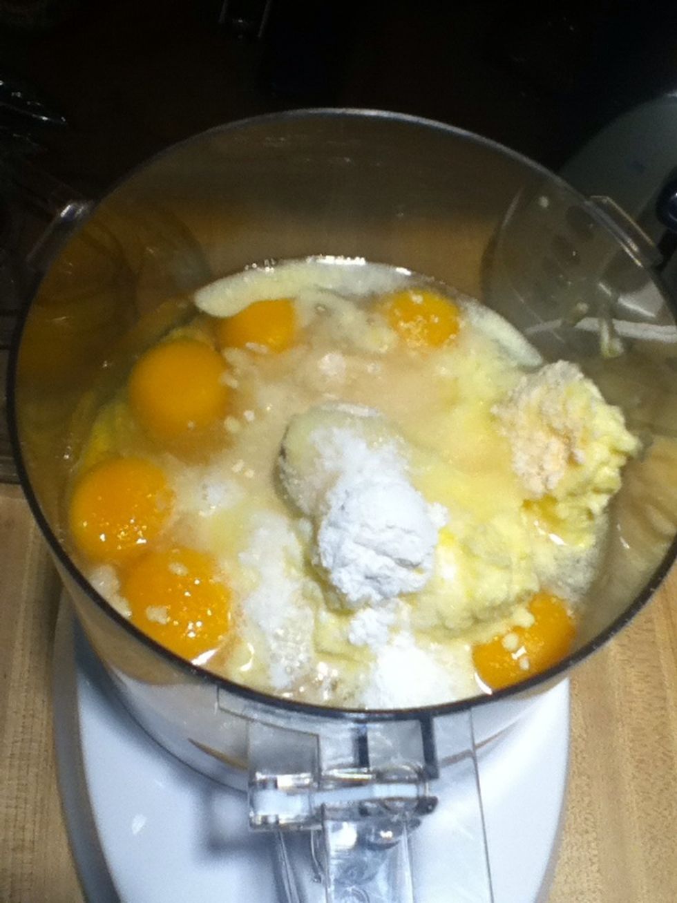 In a food processor, combine all the ingredients except the poppy seeds. Pulse for 10 to 15 seconds or until batter is smooth, then pour into a mixing bowl.