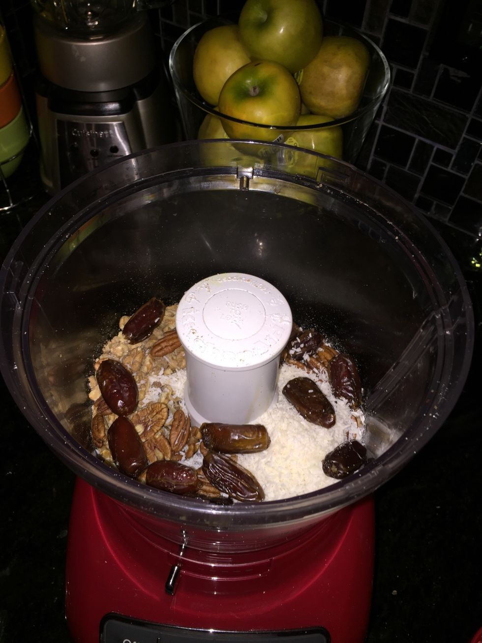 In a food processor pulse dates, shredded coconut, walnuts, pecans and pinch of salt till you get a crust like consistency. It should hold together when you pinch it.