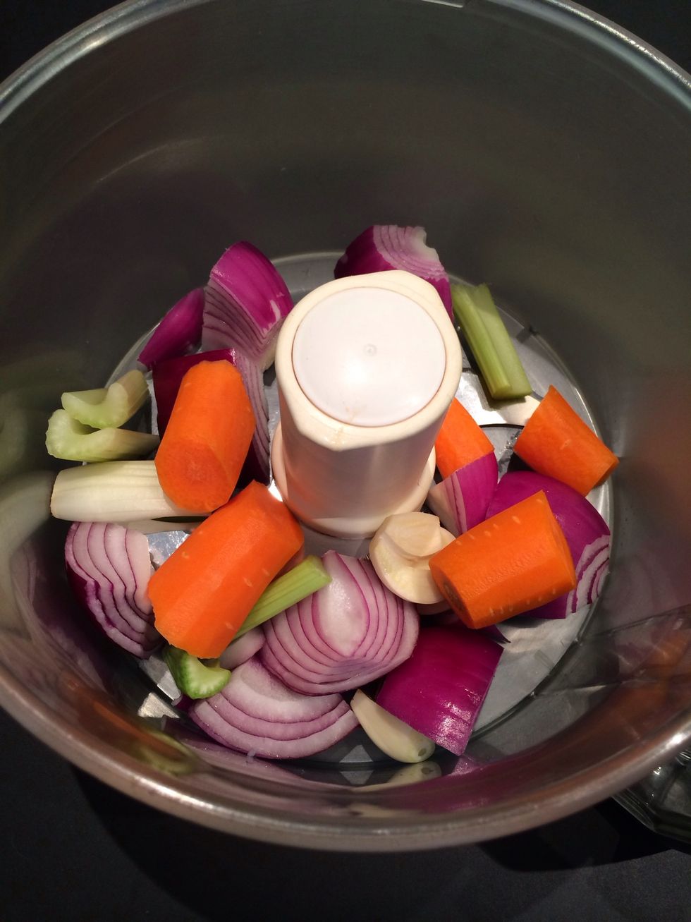 In a food processor put onion, garlic, carrot, celery.