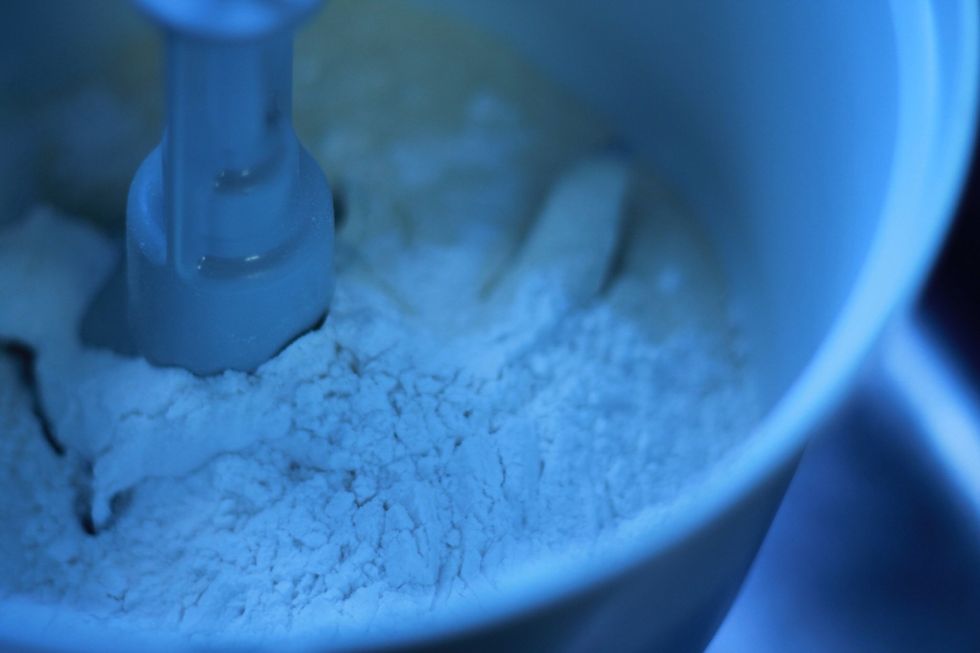 In a food processor with a blade or dough blade attachment mix together flour and salt. I used half whole wheat and half plain flour.