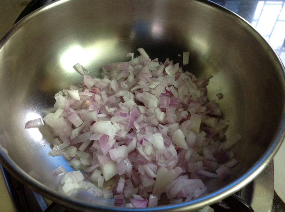 In a frying pan ( as you can see I've not used one but that doesn't really matter) heat the onions and oil. Heat till the onions turn golden brown.