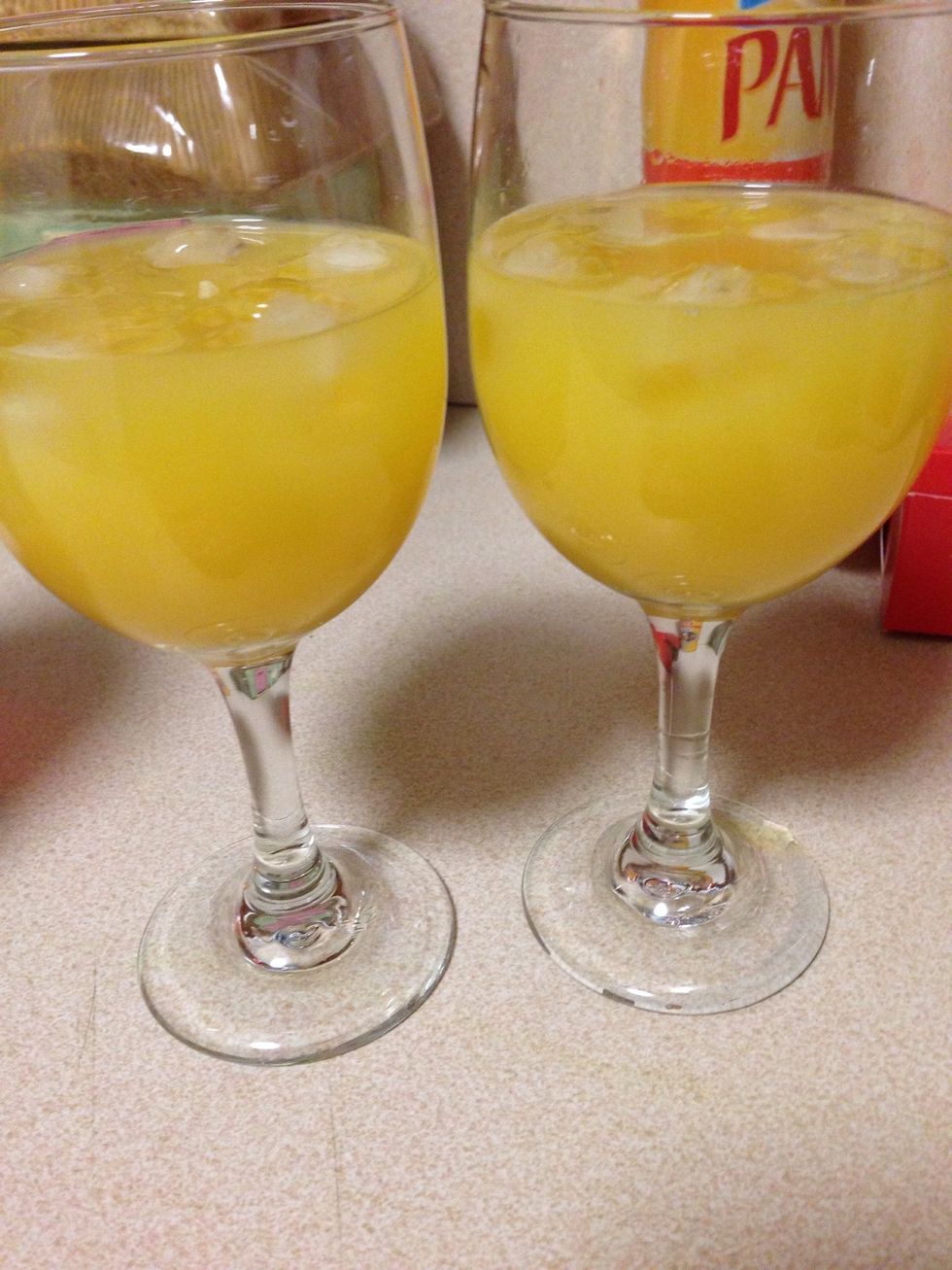 In a glass put ice, tequila and orange juice, then tilt the glass and slowly pour 2 dashes of grenadine along the edge of the glass. Making sure it goes straight to the bottom.