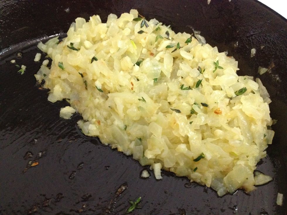 In a heated pan Combine oil, onions, garlic, and thyme. Cook till translucent, about 5 minutes on medium heat.