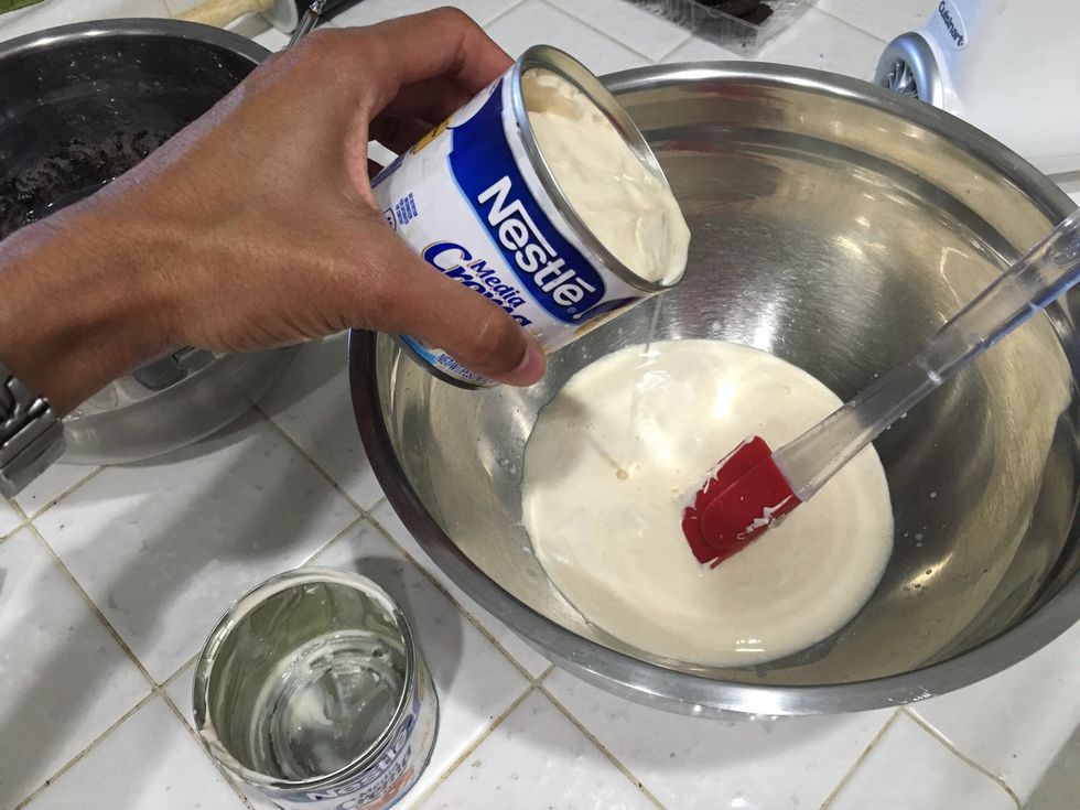 In a large bowl add 2 cans of heavy cream using the can from the condensed milk. I used media cream and it didn't fluff too much