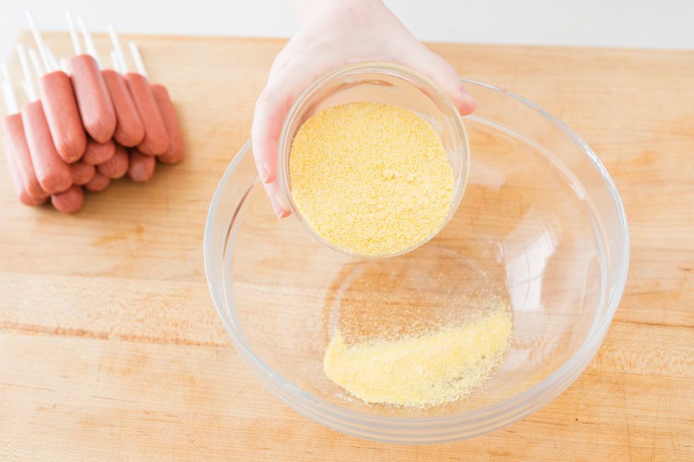 In a large bowl, add cornmeal.