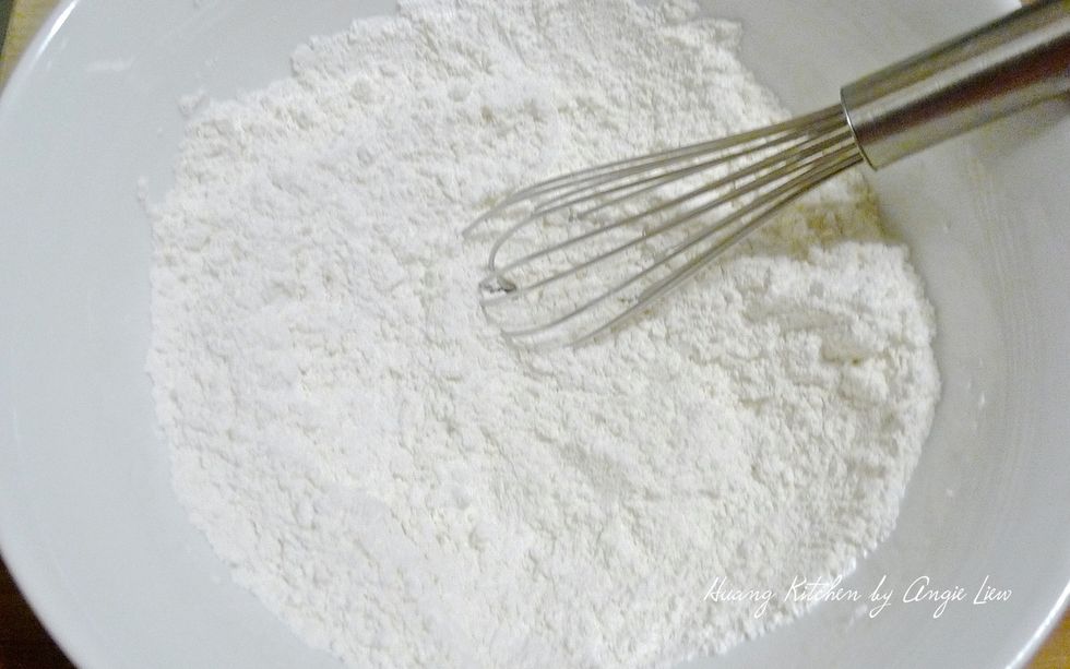 In a large bowl, add in flour, followed by baking powder, baking soda and salt. Mix everything together.