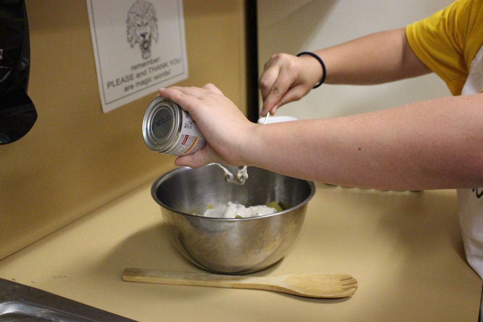 In a large bowl, add soup to green beans.