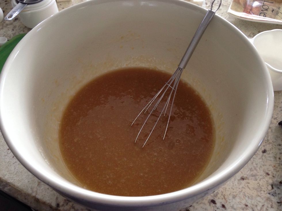 In a large bowl, beat together the 4 eggs, 3/4 cup oil, 1/2 cup applesauce, 2 cups of white sugar, and 2 teaspoons of vanilla.