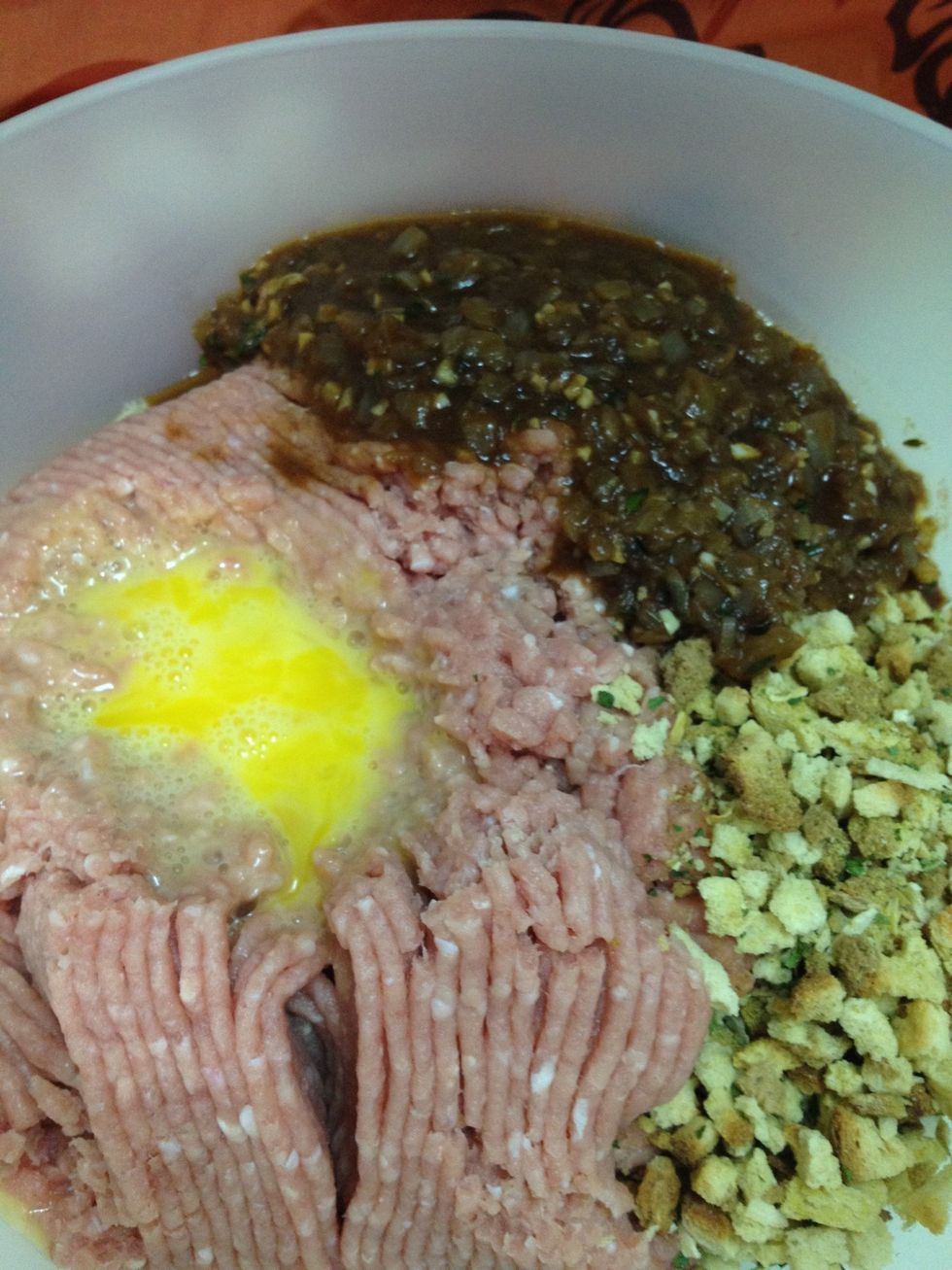 In a large bowl, combine ground turkey, eggs, turkey stuffing mix, and the cooked onion mixture that was prepared earlier.  Mix until everything is well combined.