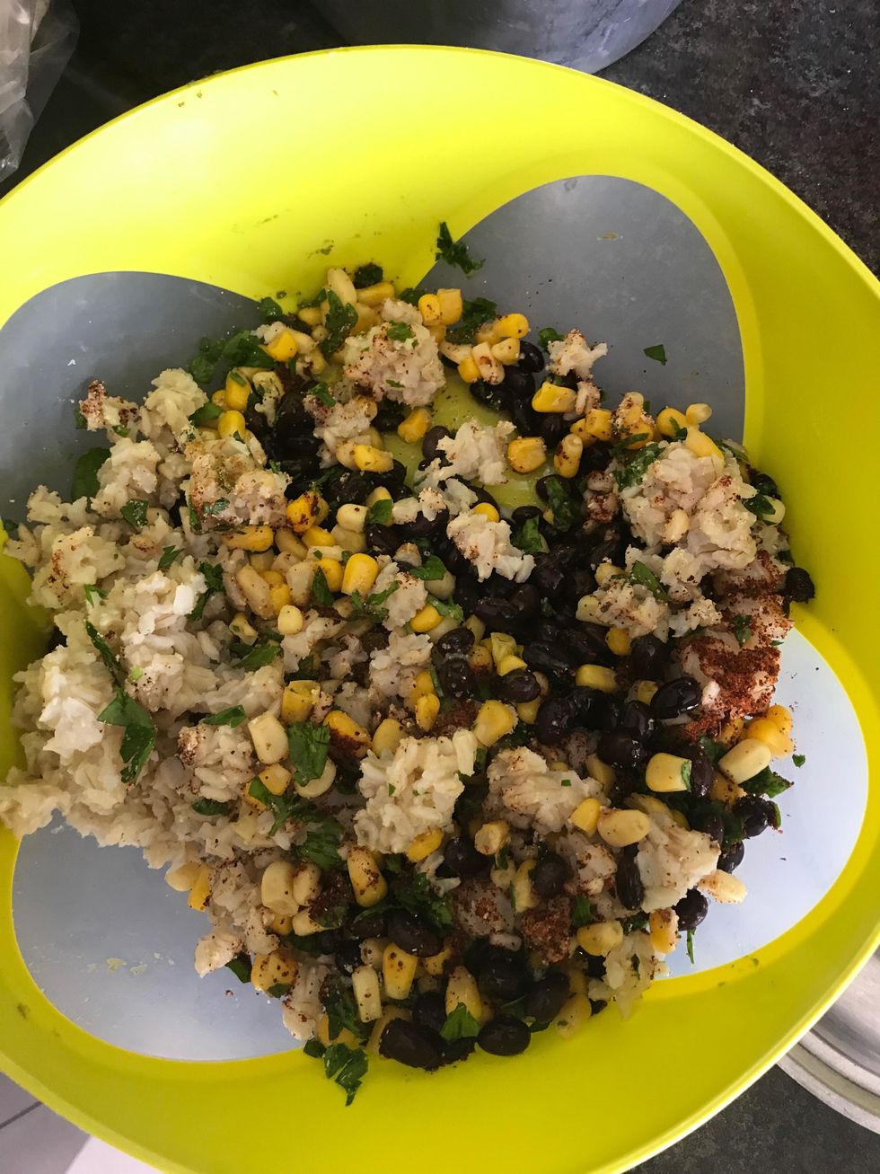 In a large bowl, combine quinoa, green chiles, corn, beans, tomatoes, cheeses, cilantro, cumin, garlic, onion and chili powder, salt and pepper, to taste