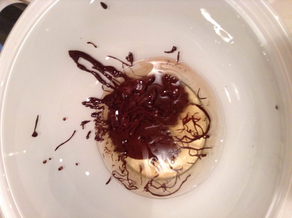 In a large bowl mix the vegetable oil with the chocolate.