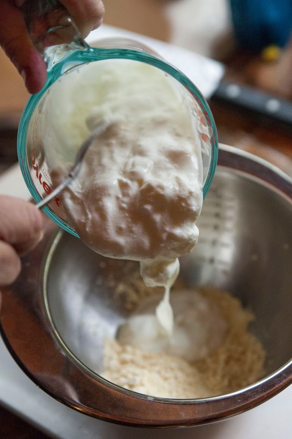 In a large bowl mix together 4 Tbs of besan flour, 1 and 1/2 cup of plain yogurt.