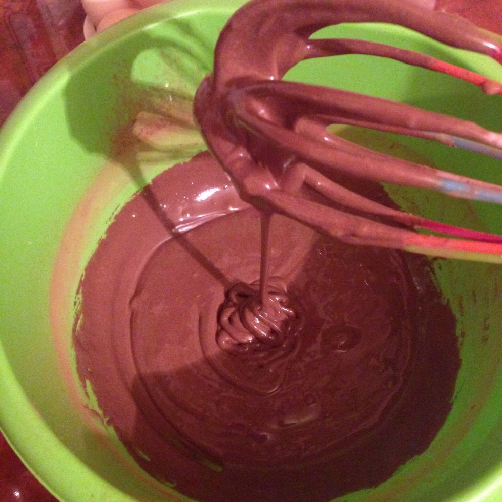 In a large bowl mix together the condensed milk and the cocoa powder(by the way this two ingredients are very tasty together, put in on the slice of bread and  enjoy)\ud83d\ude0a\ud83d\ude0a