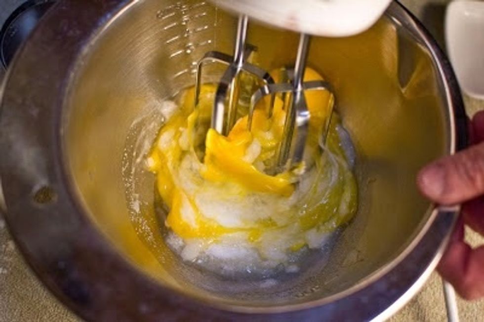 In a large bowl, mix together the eggs, sugar and salt.Use a whisk or a handheld beater and whip everything on a medium speed for about 5 minutes until the mixture is thick, pale and fluffy.