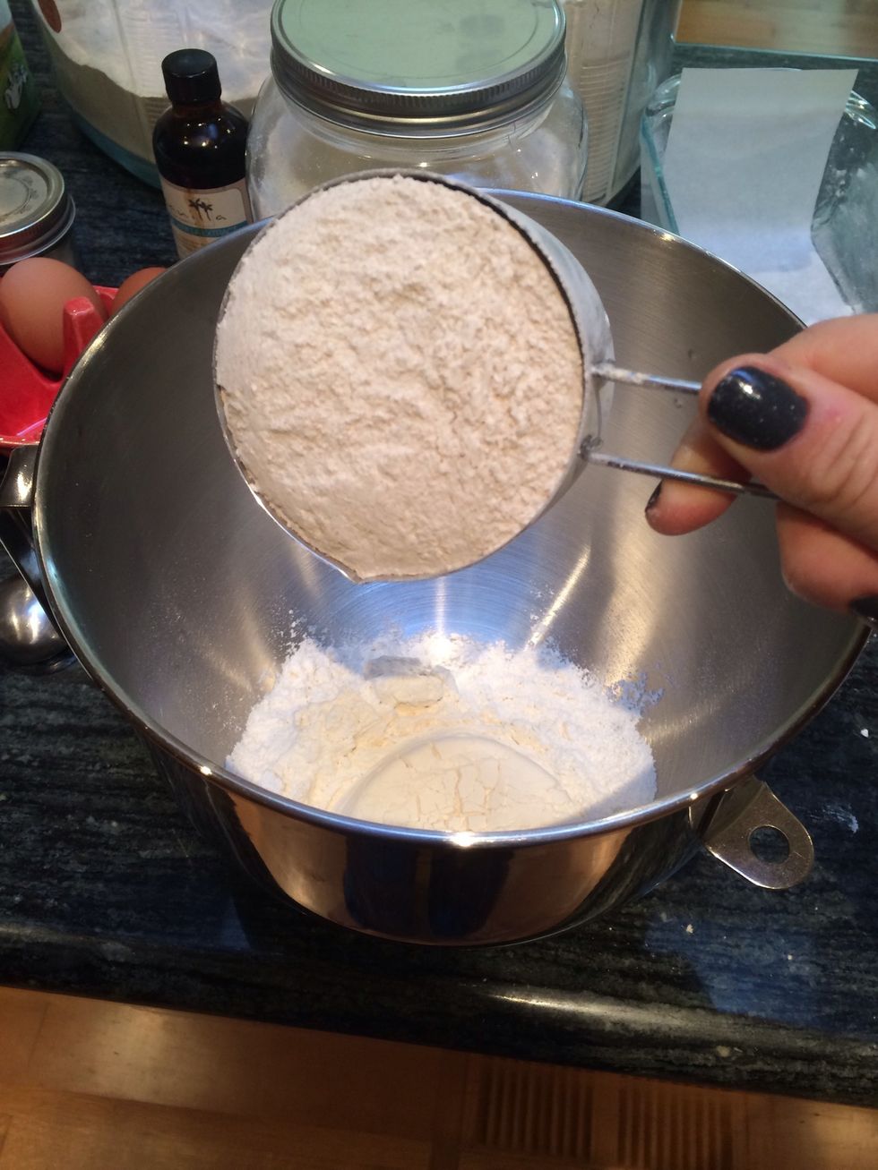 In a large bowl, mix together the two different types of flour.