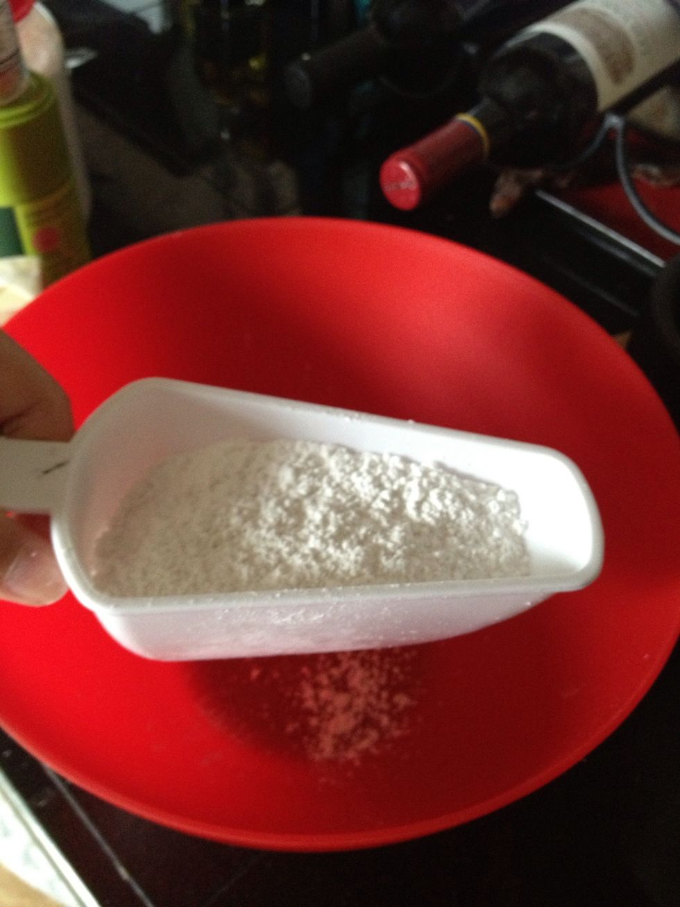 In a large bowl or the bowl of your stand mixer, whisk together the powdered sugar and powdered green tea.