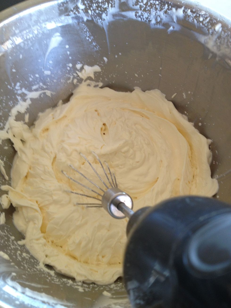 In a large bowl, whip the cream until stuff peaks form
