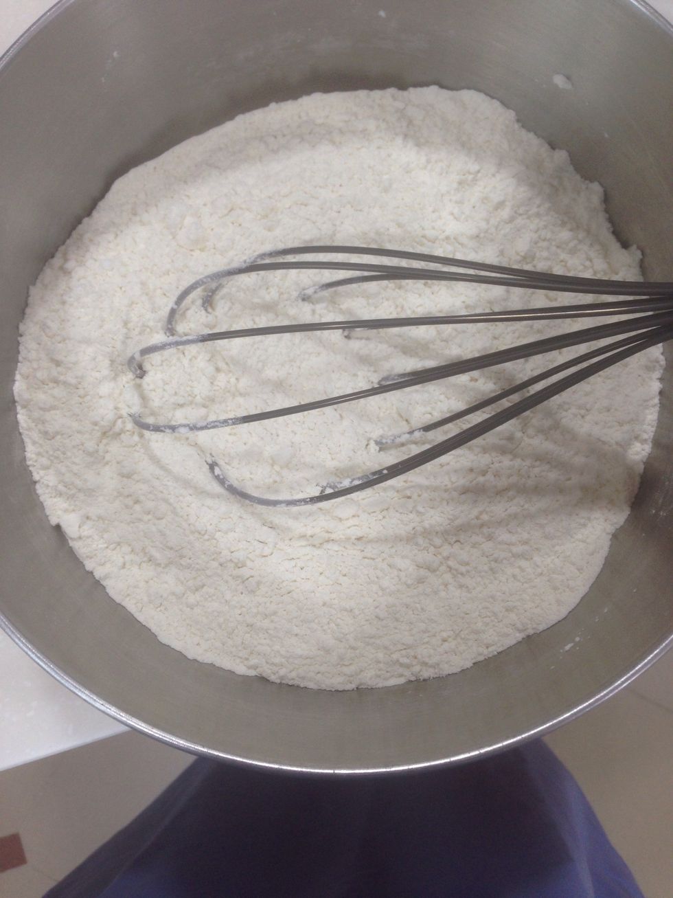 In a large bowl, whisk together 4 cups flour, 2 cups sugar, 3 tsp baking powder, 1 tsp baking soda, and 1 tsp salt.