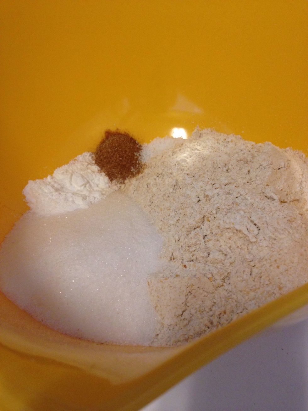 In a large bowl, whisk together the whole wheat flour, white sugar, baking powder, 1/2 tsp cinnamon, and salt - set aside.