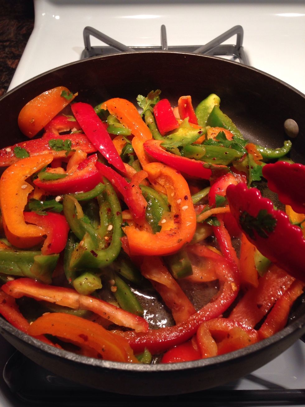 In a large frying pan on medium- high heat add 2 tablespoon of vegetable oil. Add bell pepper mixture to pan. Stirring often, for about ten minutes or until edges of bell peppers start to brown.