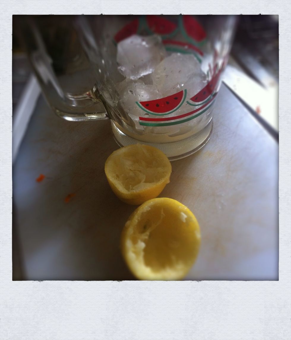 In a large jug, add some ice and squeeze in a whole lemon, ensuring no seeds have landed in the juice. Now add the juices leaving the pur\u00e9e until last.