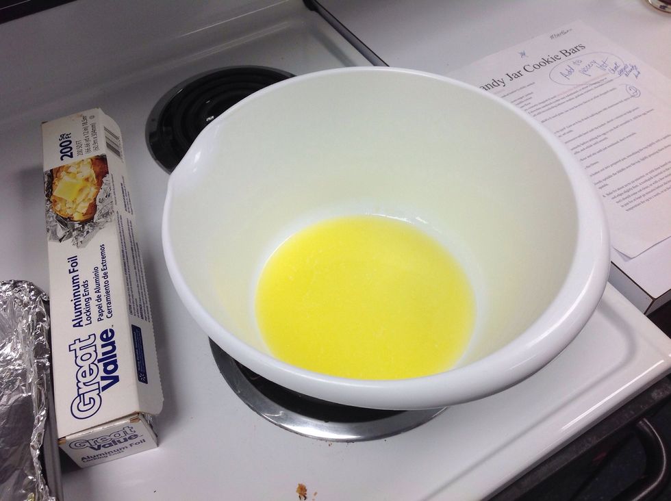 In a large, microwave-safe bowl melt the butter, about 1 minute on high power