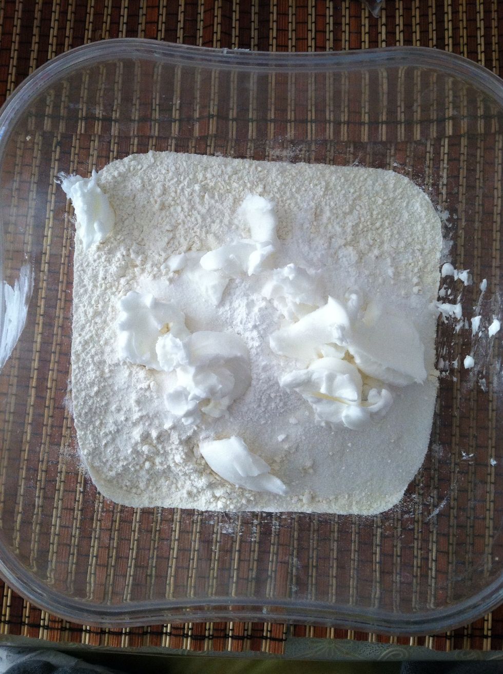 In a large mixing bowl add 5 cups flour, 1/2 cup sugar, 2 1/2 tbs baking powder, and 6 tbs shortening. Mix until ingredients are combined..then add your water and yeast mixture.