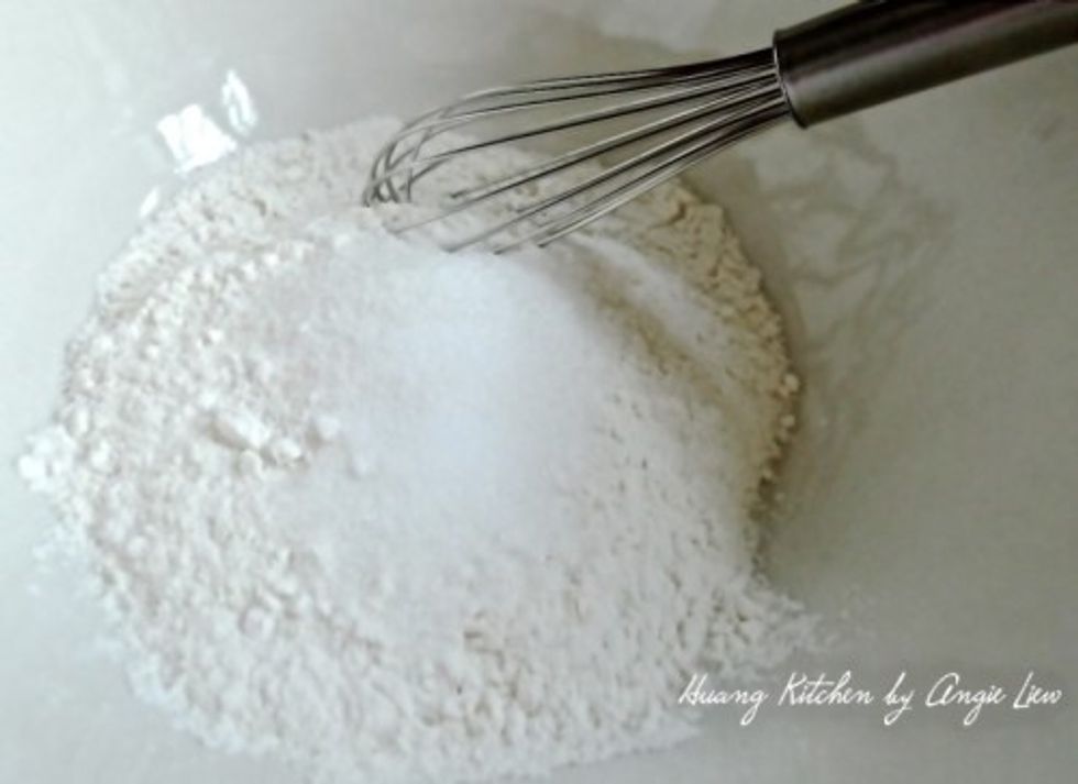 In a large mixing bowl, add all-purpose flour, sugar and salt. Whisk all these dry ingredients together until well combined.