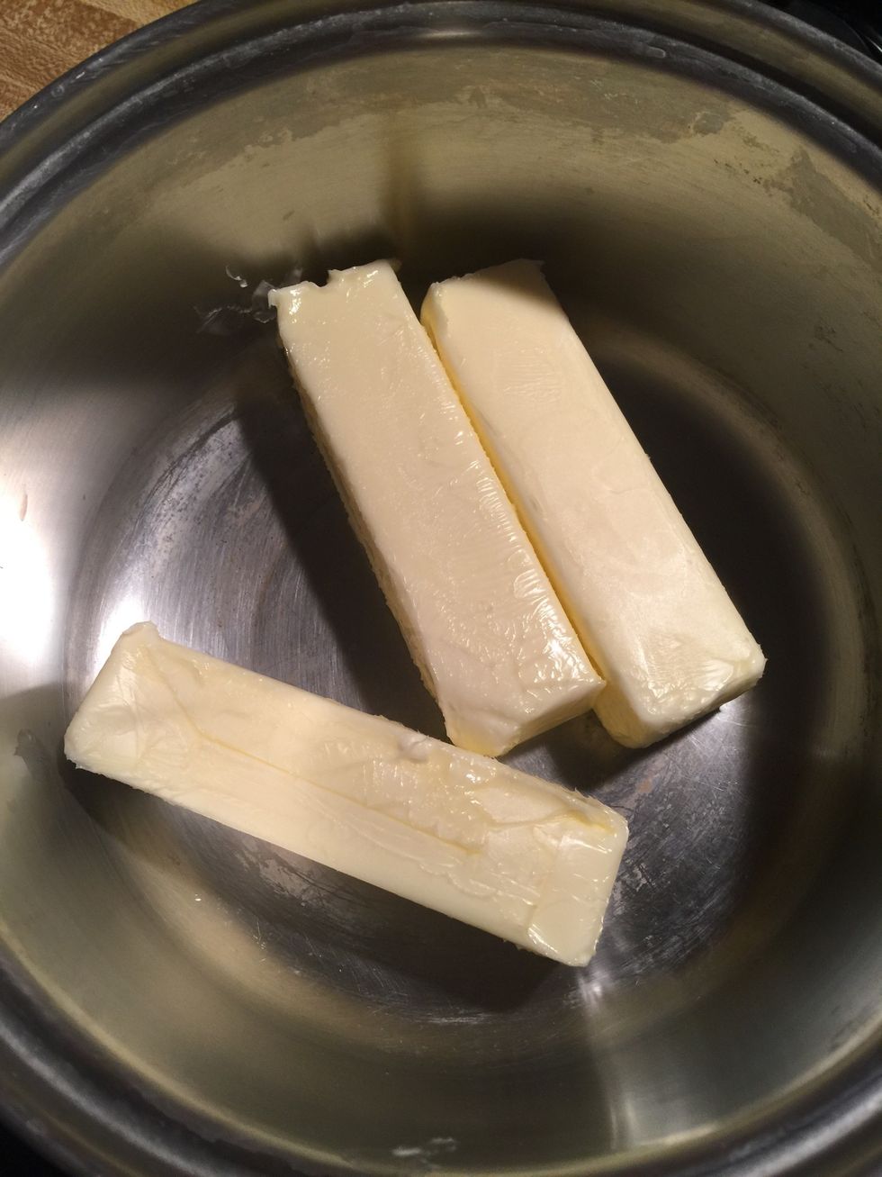 In a large pan add butter