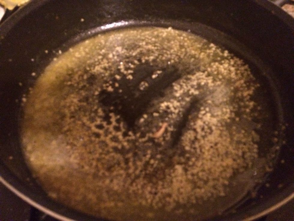 In a large pan, heat up 1 tablespoon of butter. Add 1 tbls chopped garlic. Add red pepper flakes(optional)