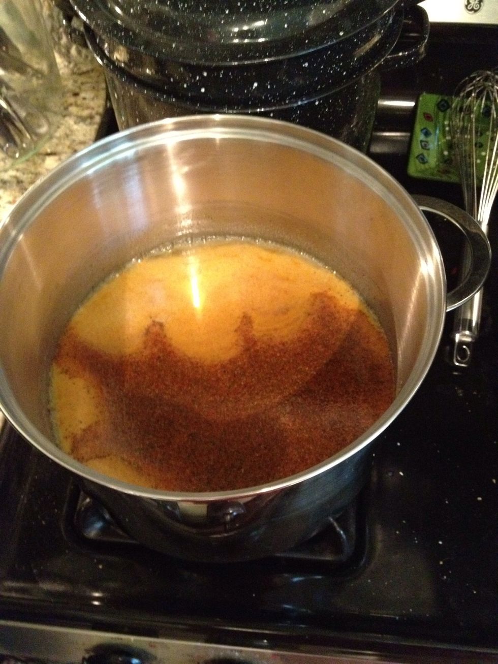 In a large pot, combine the apple cider vinegar, sugar, turmeric, celery seed, garlic powder and cayenne pepper and bring to a boil.