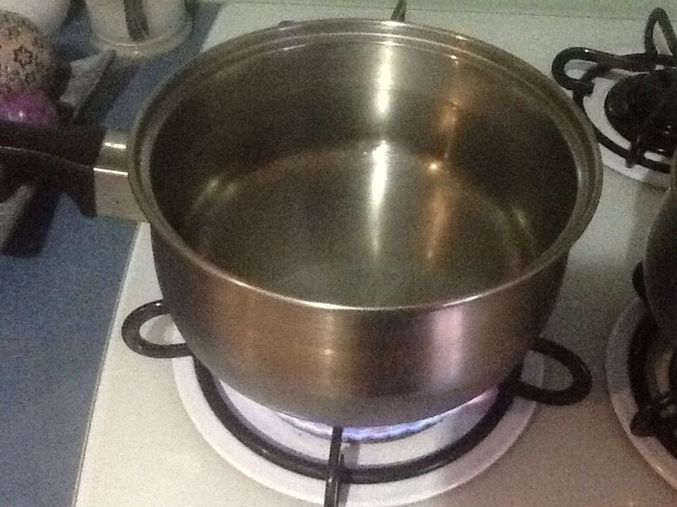 In a large saucepan, fill 3/4 full with water. Place on high heat on a stove and wait for it to boil. Once the water is boiling, add the salt.
