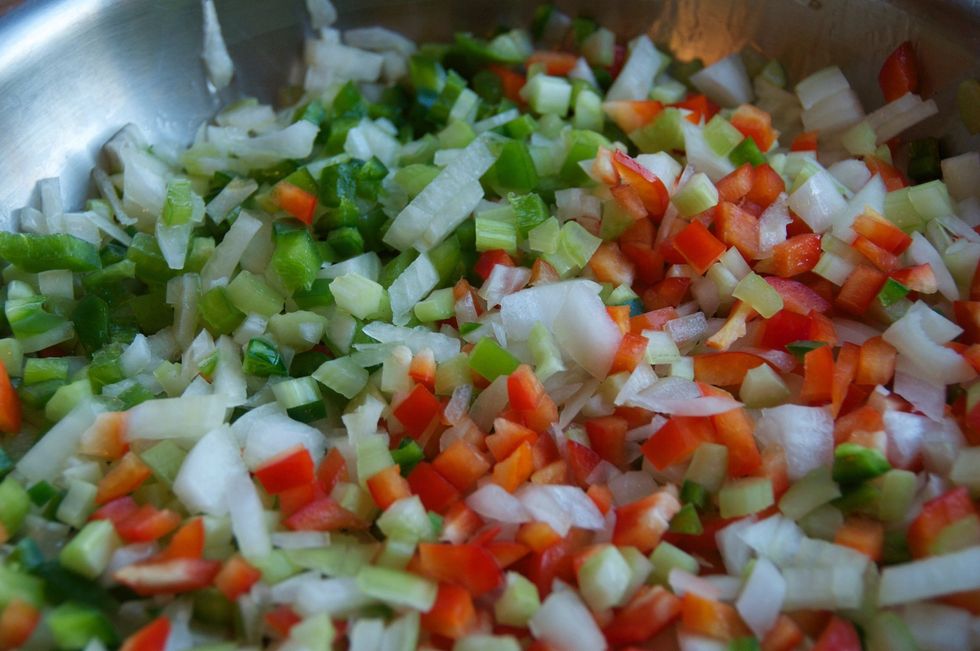 In a large saut\u00e9 pan, add 2 tablespoons of olive oil and place over medium high heat.  Add the bell peppers, the jalapeno, the 2nd onion, and the last 2 teaspoons of Smokin' Chipotle. Cook until soft.