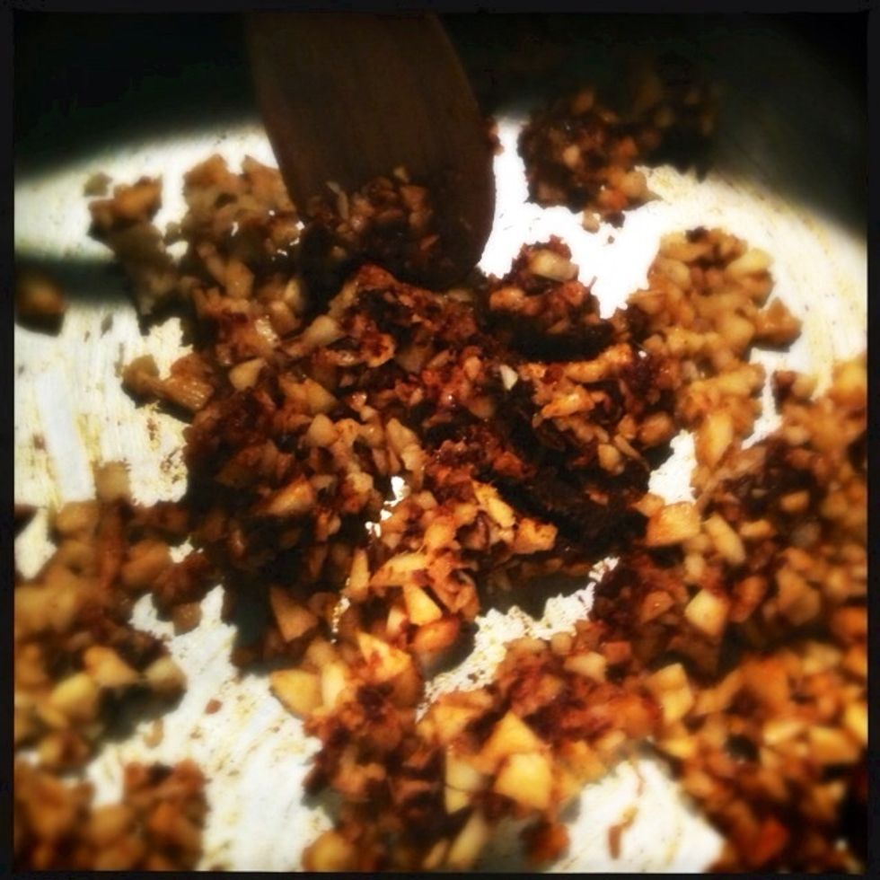 In a large soup pot, over medium heat, add chopped ginger and curry paste. Stir until heated through.