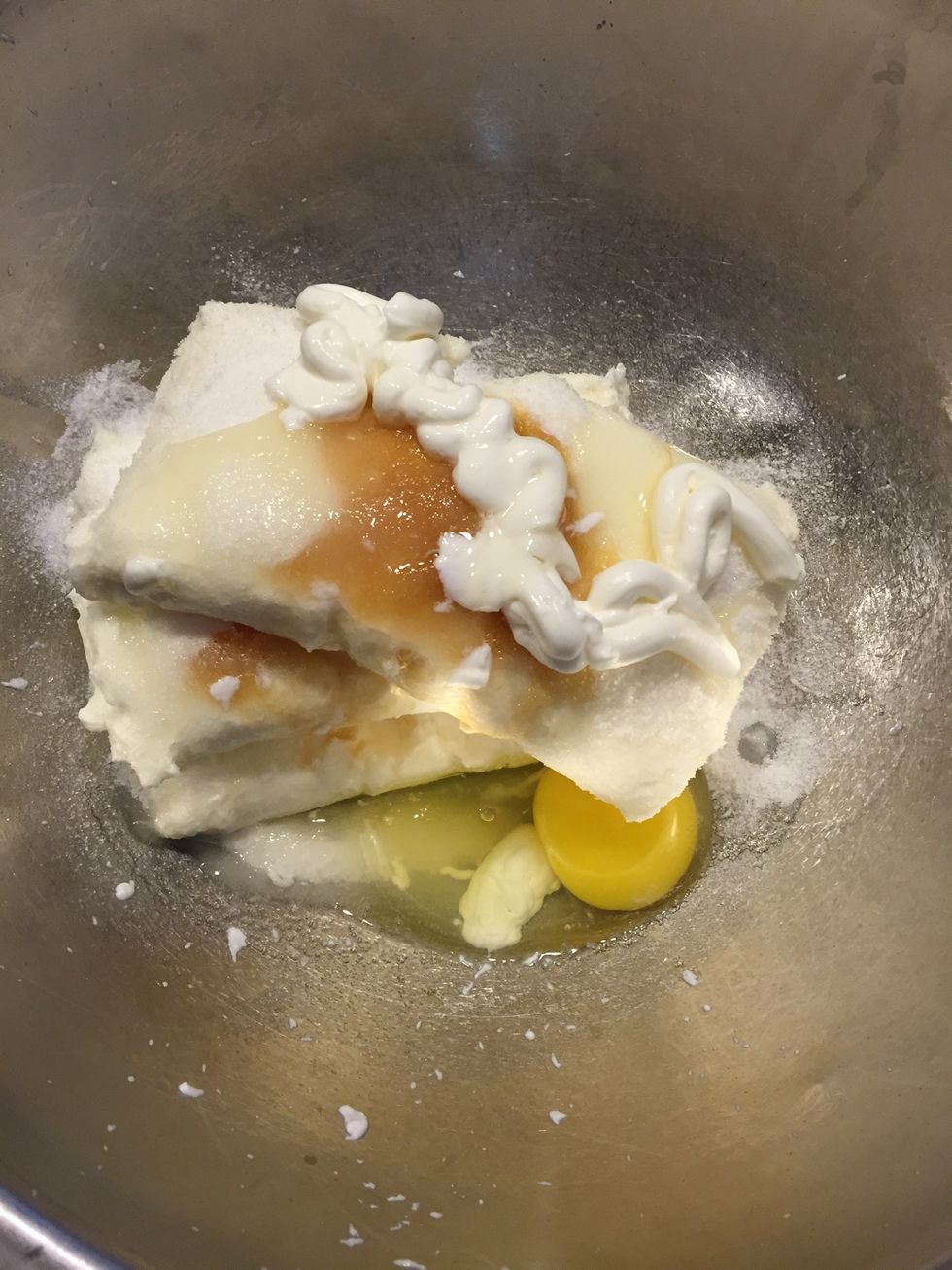 In a medium bowl. Combine cream cheese, sugar, vanilla extract, and mix adding one egg at a time.