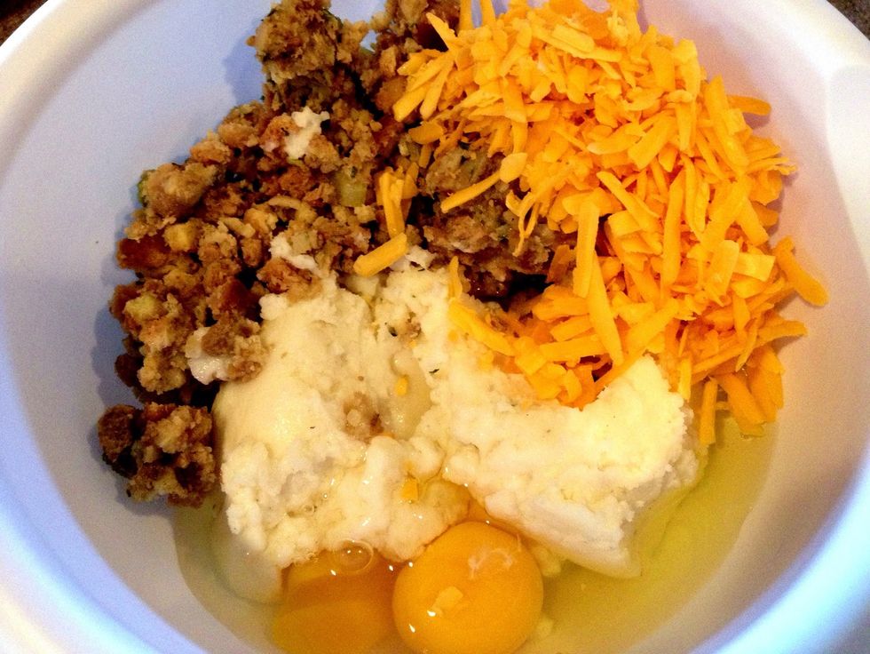 In a medium bowl, combine potatoes, eggs, stuffing, and cheese. You can dice the bacon & stir it in on this step if you like. I just halved the strips to serve on the side this time.