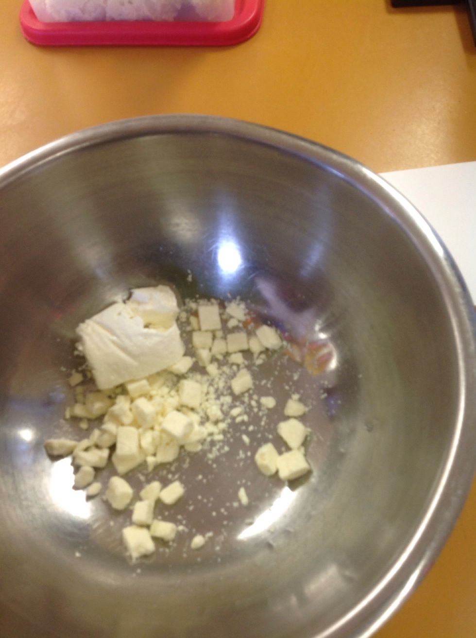 In a medium bowl combine the feta and cream cheese. Use the whisk, whip the 2 ingredients together.