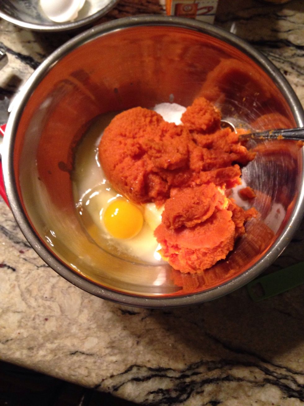 In a medium bowl, cream together the butter and sugar. Add pumpkin, egg, and vanilla and beat until creamy. Mix in dry ingredients until just combined. Drop on cookie sheet by tablespoonfuls