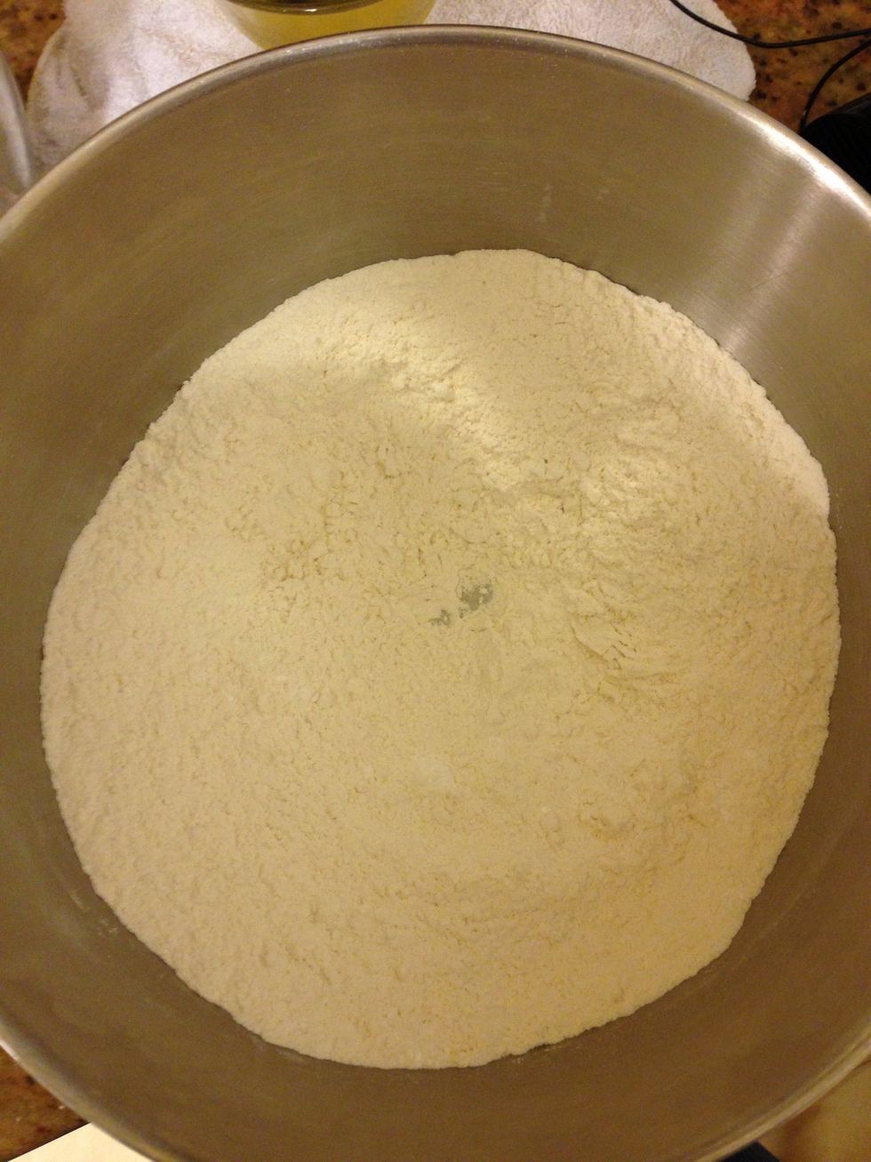 In a medium bowl mix together, flour, 3/4 cup sugar, baking powder & salt.